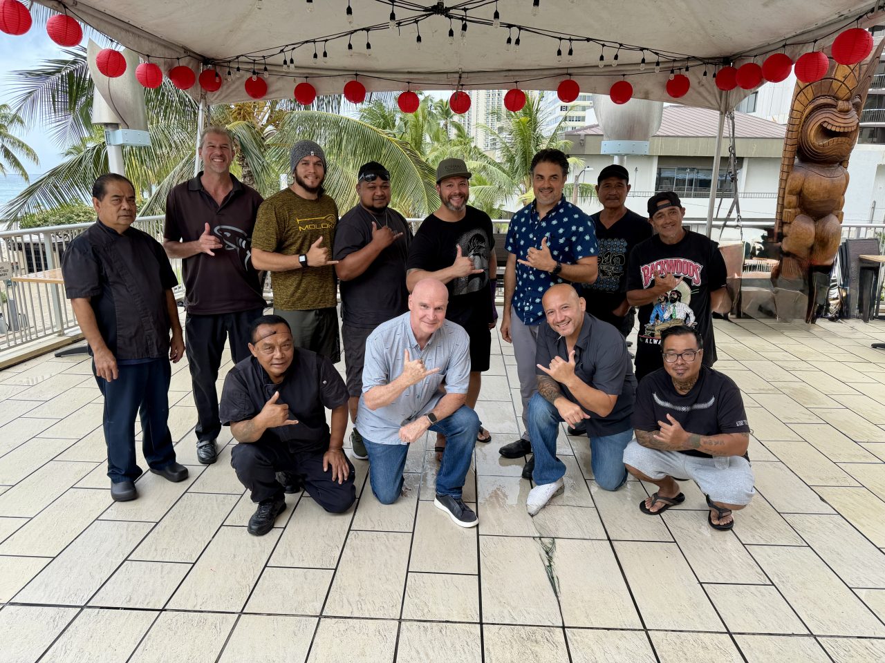 The fathers of Tiki’s Grill & Bar smiling together in Waikiki for Father’s Day