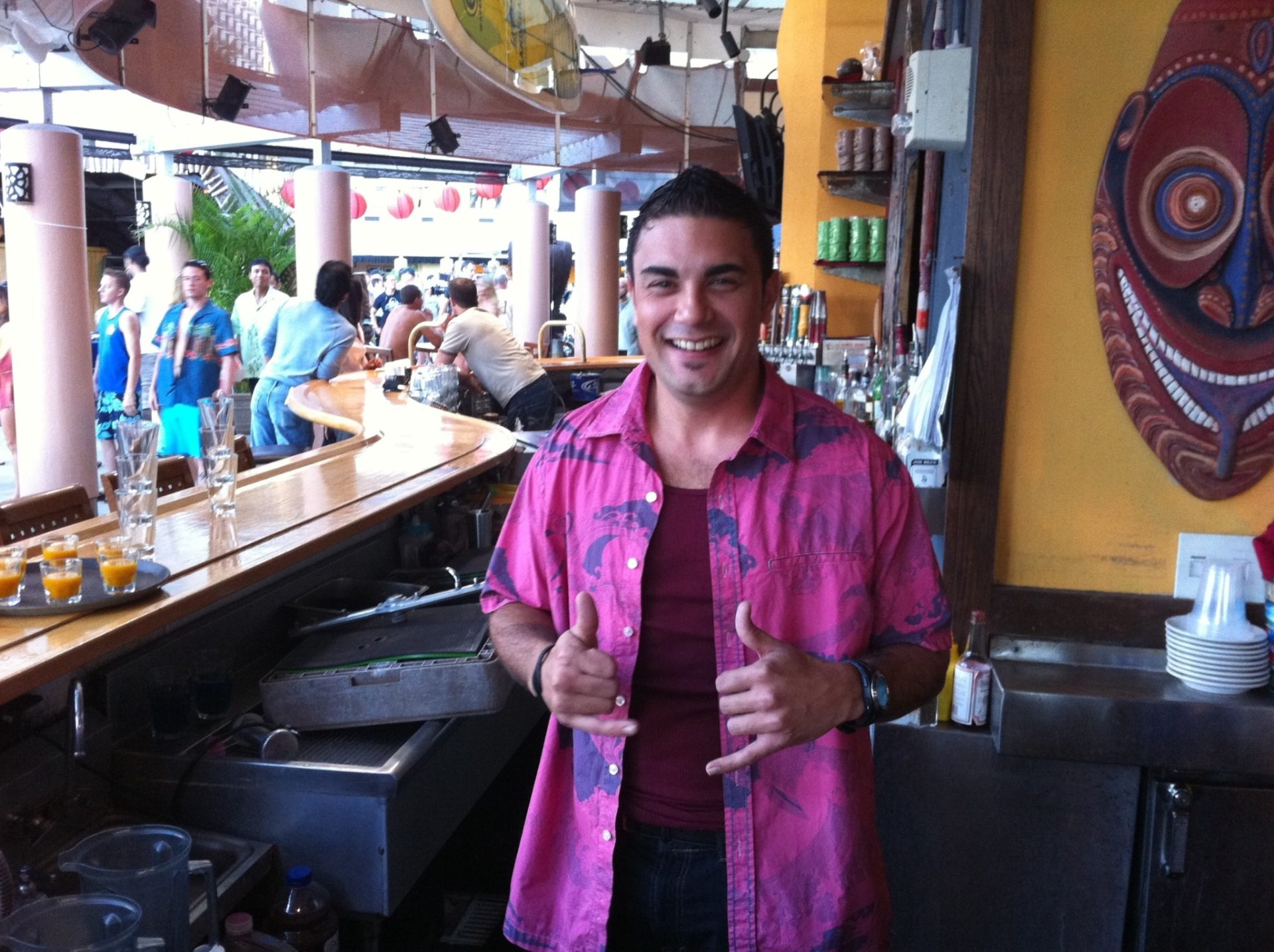 Erik Harris behind the bar during Hawaii Five-0 filming at Tiki's Grill & Bar in Waikiki