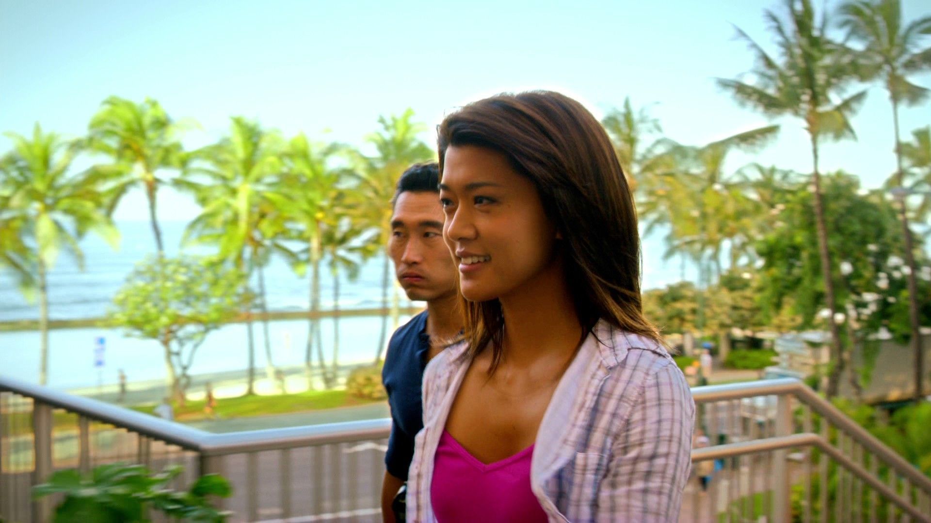 Chin Ho Kelly (Daniel Dae Kim) and Kono Kalakaua (Grace Park) walking up the stairs to Tiki's Grill & Bar during Hawaii Five-0 filming in Waikiki